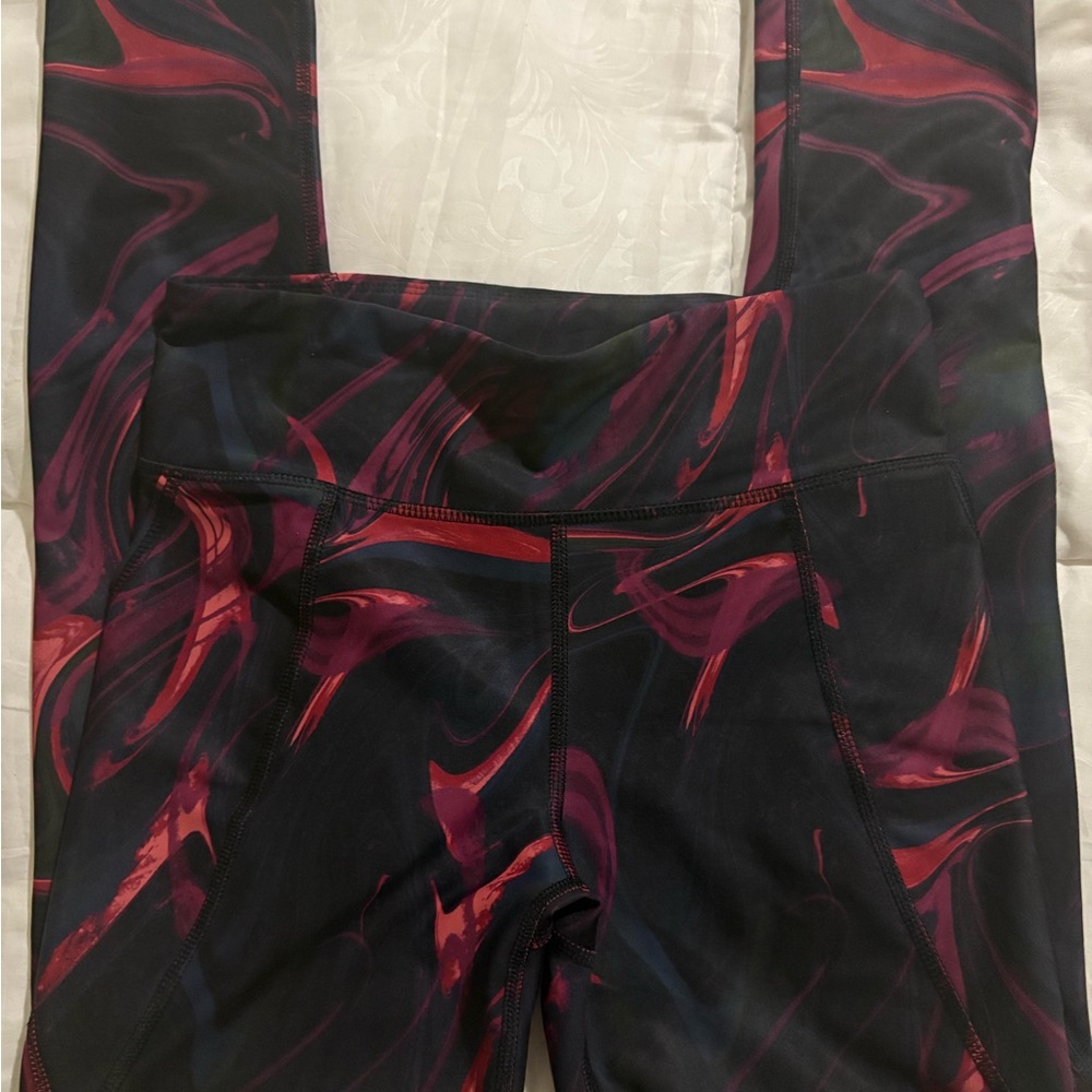 Dynamic Black and Red Leggings with Artistic Flair